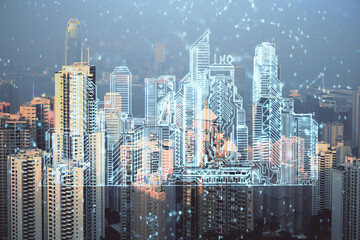 Double exposure of buildings hologram over cityscape background. Concept of smart city.