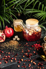 Fruit hot tea with the addition of oranges, lemons, mandarins and raspberries in a glass cups on a table. Healthy hot drink. tea with fruit and berries in a glass teapot. tea for colds.