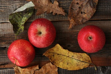 Sticker - Juicy red apples and autumn leaves on the table