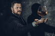 © idea_studio - Solid confident bearded man in suit with glass of whisky