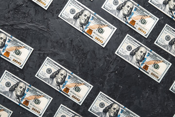  One hundred dollar bills are creatively laid out. Business concept, development perspective.