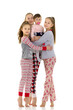 © lotosfoto - The company of little girls have fun in the studio on a white background.