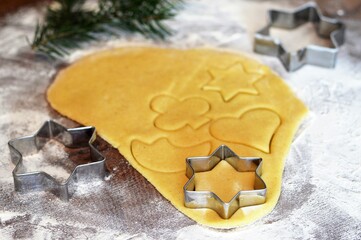  Preparing Christmas gingerbread cookies. Christmas cookie cutters and cookie dough.