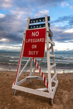 Lifeguard Stand With No Lifeguard On Duty As The Sun Sets On Lake Michigan.  Lighthouse Beach, Evanston, Illinois