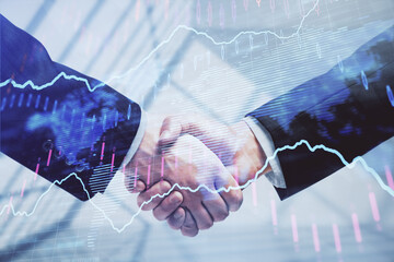 Double exposure of forex graph hologram and handshake of two men. Stock market concept.