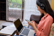 © PK Studio - woman in face mask with laptop during Learning at home