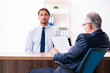 © Elnur - Young male candidate employee meeting with old recruiter