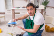 © Elnur - Young male contractor cleaning the flat after kids' party