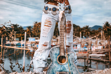 Wall Mural - Close up of beautiful young fashion model woman posing outdoors at fisherman pier background