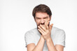 © SHOTPRIME STUDIO - Bearded man in white t-shirt gesture with hands emotions light background