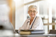 © goodluz - Portrait of mature woman doctor with eyeglasses working in hospital office