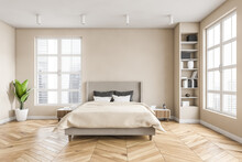 Wooden Bedroom With Bed And Linens, Beige Walls And Window With A City View