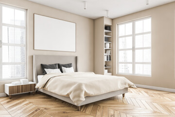 wooden bedroom and canvas over bed with linens, beige walls and window