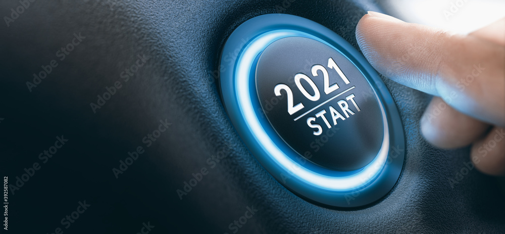 Start-stop engine button with a sign 2021 and a finger near it. New Year. - obrazy, fototapety, plakaty 