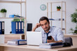 © Elnur - Young male bookkeeper working in the office