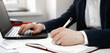 © Red Cristal - Cropped view of businessman works with financial papers at the table