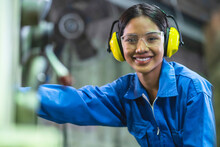 Portrait Asian Female Professional Engineering Wearing Uniform And Safety Goggles Quality Control, Maintenance, Check In Factory, Warehouse Workshop For Factory Operators
