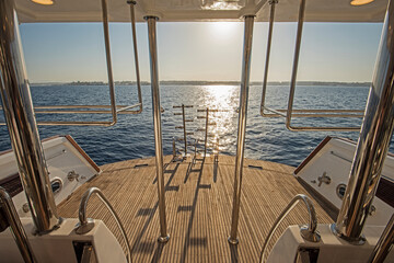 Ladders on the back wooden deck of a luxury motor yacht