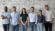© fizkes - Happy people. Group portrait of young successful diverse businesspeople standing in row looking at camera, motivated staff of international company, multiethnic clients satisfied with good service