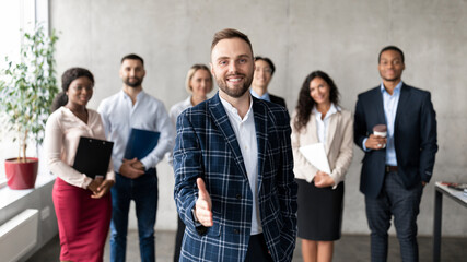 Wall Mural - Smiling Businessman Stretching Hand For Handshake Greeting In Office, Panorama