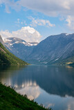 Fototapeta Do przedpokoju - Reflection from the mountains in a fjord