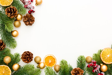 Spruce branch, cones and toys decoration on christmas or new year on white background .