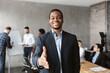 Black Businessman HR Stretching Hand For Handshake In Modern Office