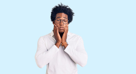 Poster - Handsome african american man with afro hair wearing casual clothes and glasses tired hands covering face, depression and sadness, upset and irritated for problem