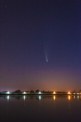 Wall Mural - a magical starry night on the river by the milky way and a comet in the sky