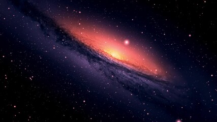 a galaxy with a bright orange light in the middle.