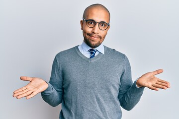 Poster - Hispanic adult man wearing glasses and business style clueless and confused expression with arms and hands raised. doubt concept.