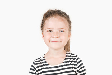 smiling girl looking at camera. smirking girl laughing inside and saying by her face i told you, i w