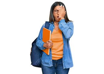 Sticker - Young latin girl wearing student backpack and holding books yawning tired covering half face, eye and mouth with hand. face hurts in pain.