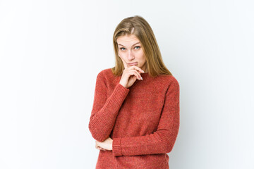 Young blonde woman isolated on white background contemplating, planning a strategy, thinking about the way of a business.