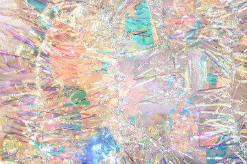 Wall Mural - peach fuzz color, christmas tinsel garland. abstract iridescent background. pastel new year shining 