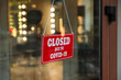 © New Africa - Red sign with words Closed Due To Covid-19 hanging on glass door, closeup