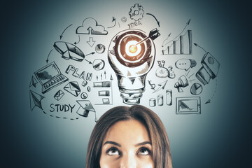 Poster - Businesswoman with drawing target lightbulb over head.