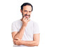 © Krakenimages.com - Middle age handsome man wearing casual t-shirt looking confident at the camera smiling with crossed arms and hand raised on chin. thinking positive.
