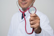 © Chanakon - Close up Physician in white put stethoscope on ears and showing in front.camera isolated on white background.