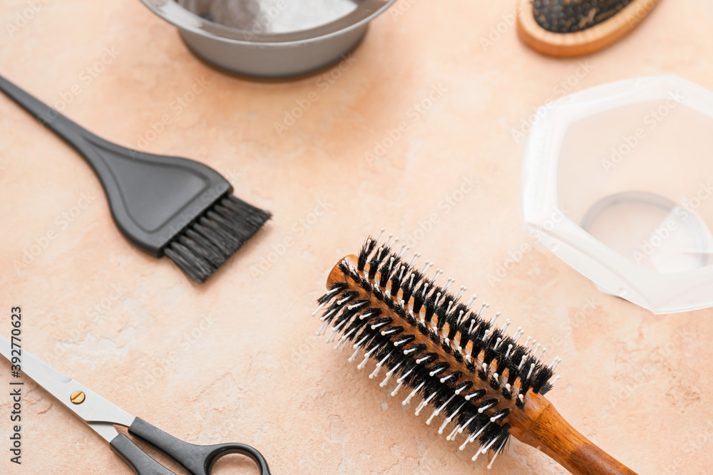 Set of hairdresser tools on color background