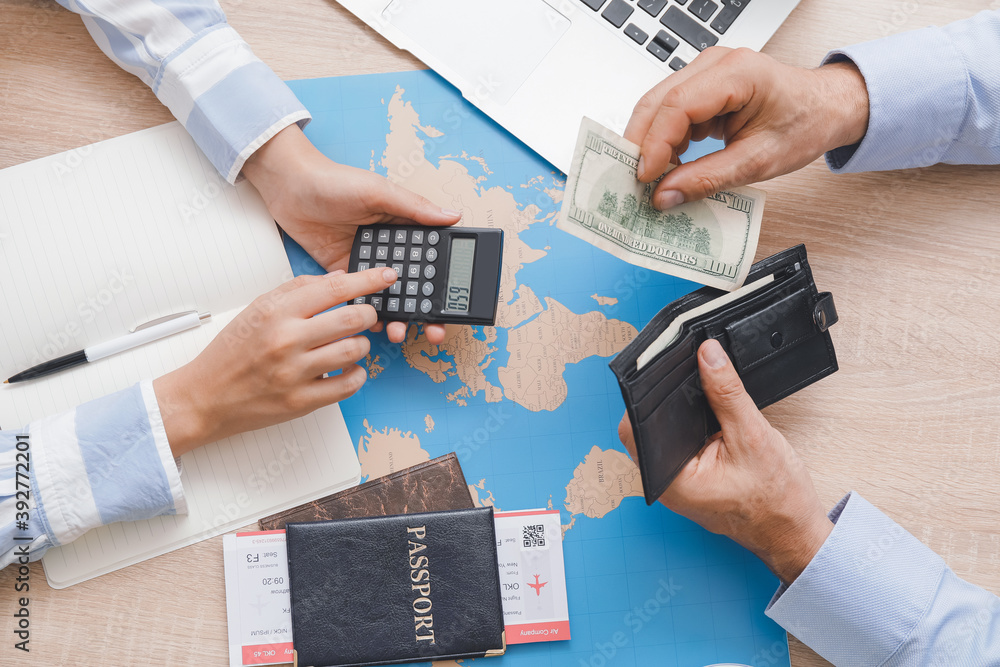 Travel agent receiving money from client for provided service in office