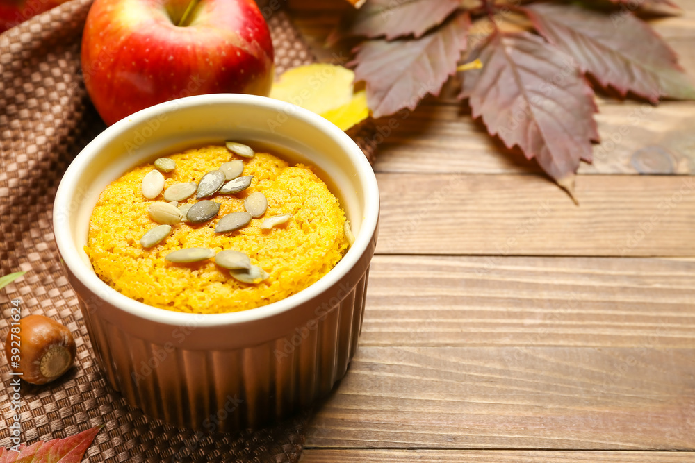 Tasty pumpkin pudding on table
