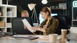 © stockbusters - Successful woman discussing documents with attractive guy in stylish office.
