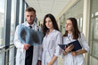© RomanR - Group of doctors looking at X-ray lungs for prescribing effective treatment for new virus covid19