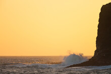 Sunset Ocean Scene Wave Pounds High Cliff Shore