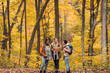 © Zoran Zeremski - Three female friends having fun and enjoying hiking in forest on a beautiful autumn day.