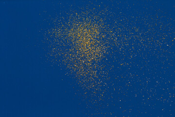 Wall Mural - Gold glitter on blue background. Holiday abstract texture