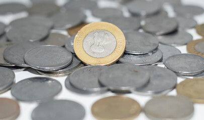 Wall Mural - Indian rupee coins scattered on white background