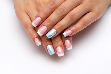 French manicure with white, light blue and silver matte nail on long square nails close-up on a white background.