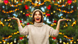 © Syda Productions - winter holidays and people concept - smiling woman over christmas tree lights on background